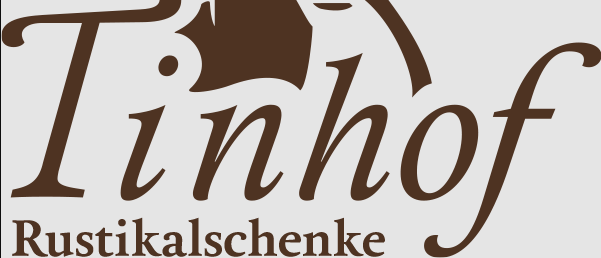 Das Tinhof-Logo mit einem stilisierten Pferd und dem Text 'Landgeschenke'.