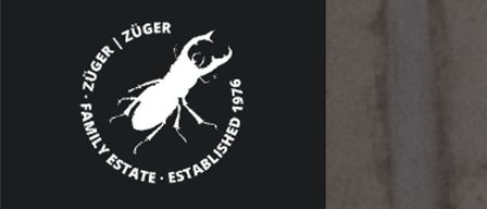 Ein Logo für Züger Family Estate, gegründet 1976, zeigt einen weißen Käfer mit Text im Kreis angeordnet.