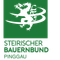 Das Bild zeigt das Logo des Steirischen Bauernbundes Pinggau auf einem grünen Hintergrund. Das Logo enthält einen stilisierten schwarzen Drachen und weißen Text.