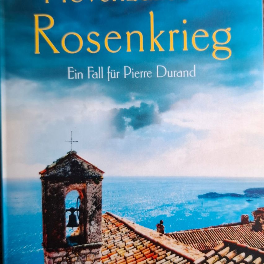 Buchcover mit Meerblick und Glockenturm, betitelt 'Rosenkrieg', Untertitel 'Ein Fall für Pierre Durand'.