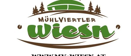 Logo for Mühlviertler Wiesen with a green hill, trees, and flags. Website is www.mvw-wiesen.at.