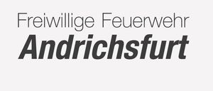 Ein Logo für die Freiwillige Feuerwehr Andrichsfurt mit einer goldenen Flamme, einem Zahnrad obenauf und den Worten 'Freiwillige Feuerwehr Andrichsfurt' darunter.