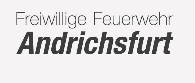 Ein Logo für die Freiwillige Feuerwehr Andrichsfurt mit einer goldenen Flamme, einem Zahnrad obenauf und den Worten 'Freiwillige Feuerwehr Andrichsfurt' darunter.