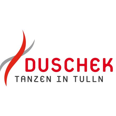 Das Logo für Duschek Tanzen in Tulln, mit einer stilisierten roten Flamme und grauen Umrissen. Das Wort 'Duschek' ist in fetten roten Buchstaben über der Flamme geschrieben, während 'Tanzen in Tulln' in kleineren grauen Buchstaben darunter steht.