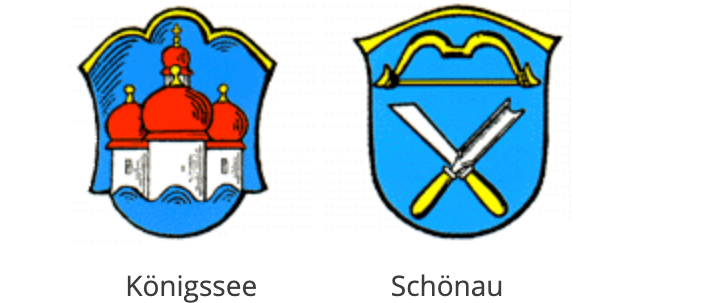 Zwei heraldische Schilde, der erste ist Königssee mit einer Burg mit roten Kuppeln. Der zweite ist Schönau mit gekreuzten gelben Scheren.