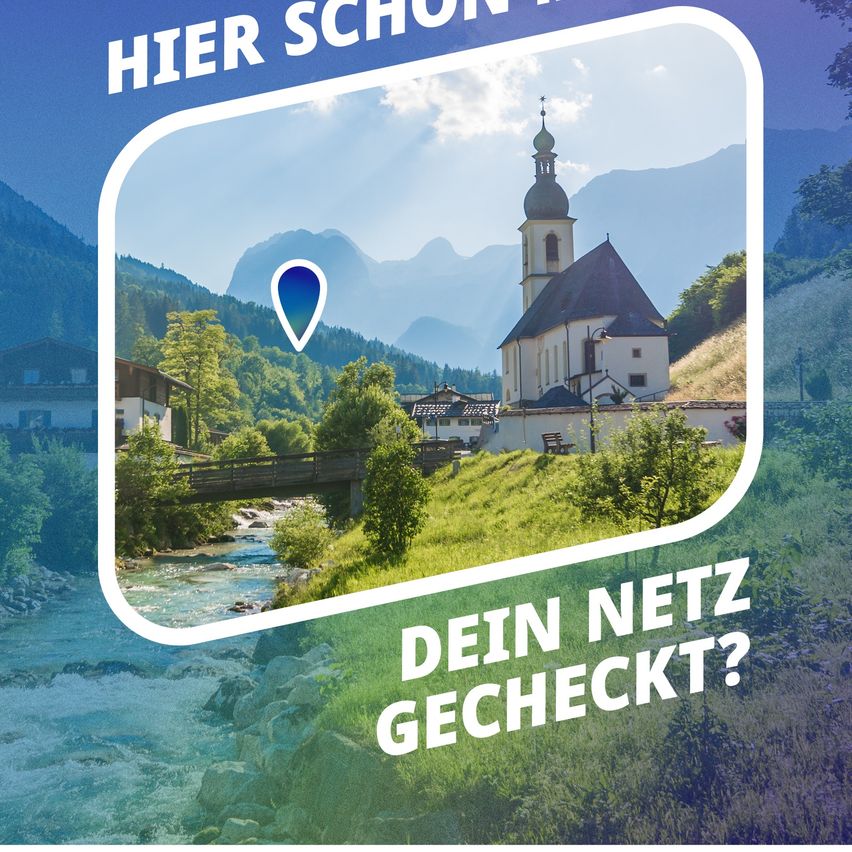 Ein malerisches Dorf mit Kirche, Brücke und Fluss, eingebettet in den Bergen. Der Text deutet auf eine Netzwerküberprüfung hin.