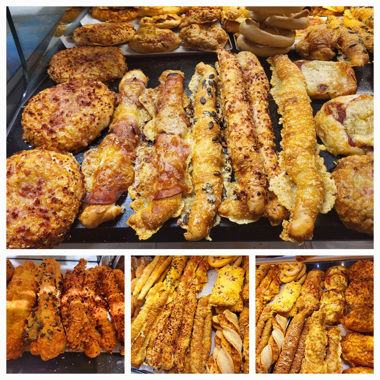 Eine Auswahl an Backwaren, einschließlich Brotstangen, Brötchen und Gebäck mit verschiedenen Toppings wie Käse, Samen und Fleisch, präsentiert auf einem Regal.