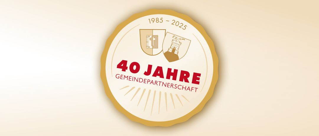 Logo für 40 Jahre Gemeindepartnerschaft, mit zwei Wappen und den Jahren 1985 bis 2025.