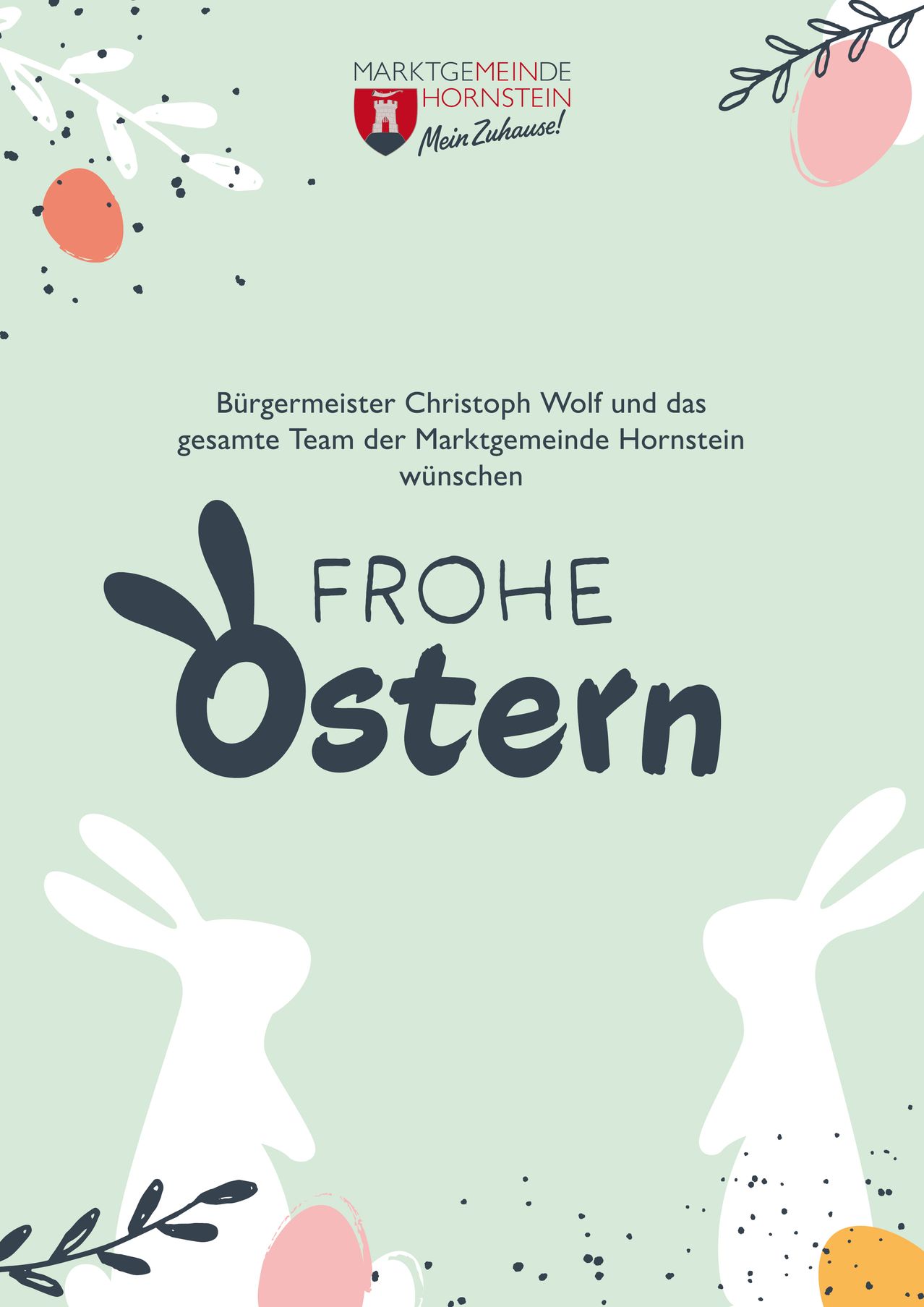 A poster with two white rabbits and the words 'FROHE OSTERN' on a green background. The poster is likely a celebration of Easter.
