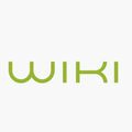 Das Wort 'WIKI' ist in einer stilisierten, modernen Schriftart dargestellt. Die Buchstaben sind grün und haben einen dicken Umriss, was dem Wort ein kräftiges Aussehen verleiht. Der Hintergrund ist weiß.