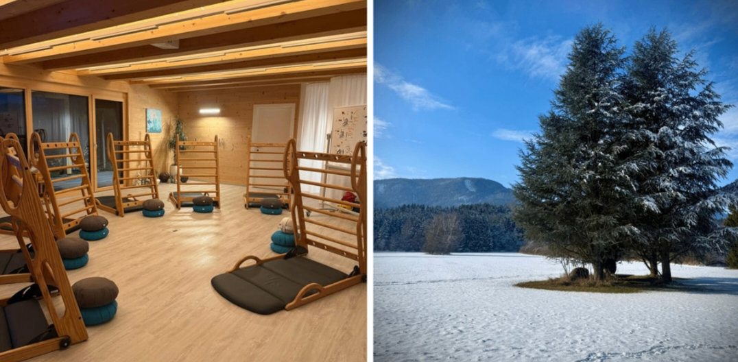 Das Bild zeigt das Innere eines Fitnessstudios mit Holzgeräten und einer verschneiten Außenlandschaft mit einem Baum.