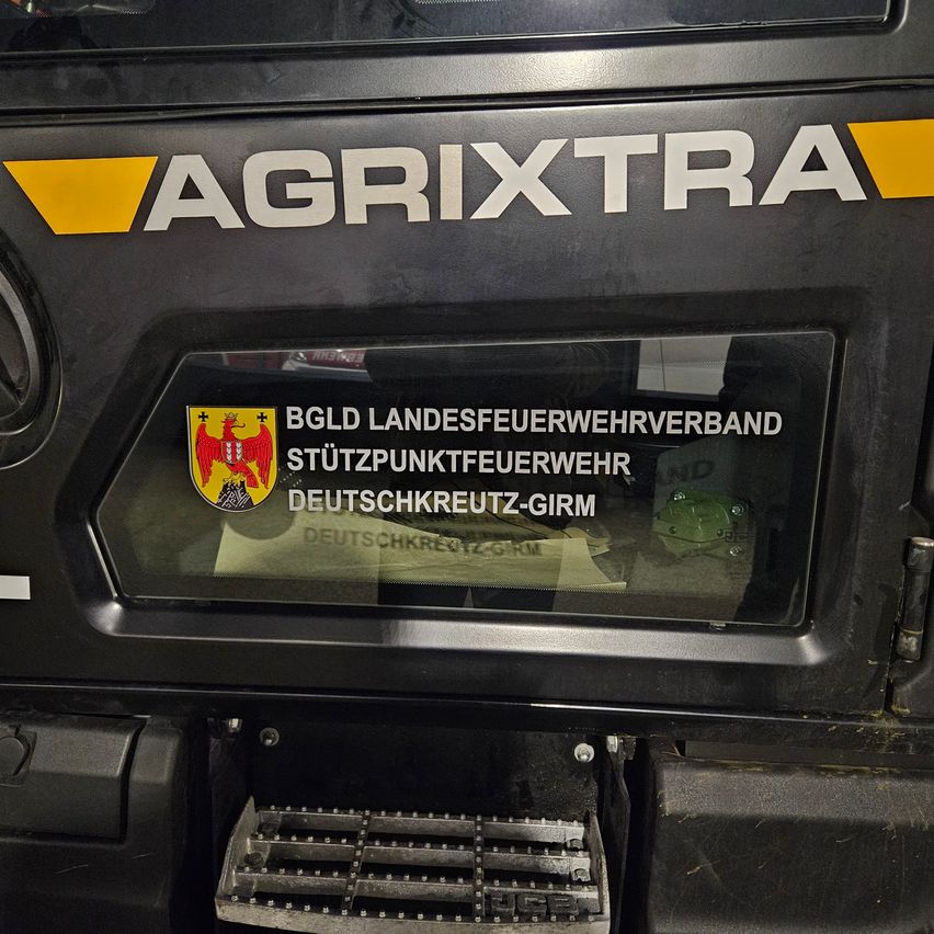 AgriXtra vehicle with a logo for the German Red Cross, a support fire department association.