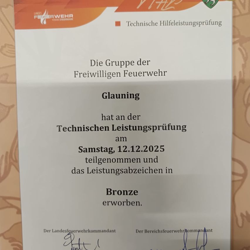The group of volunteer firefighters participated in the technical assistance test on Saturday, December 12, 2025, and achieved the Bronze award. The signatures of the district fire department commander and the area fire department commander are present.