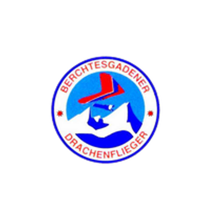 Das Logo zeigt einen stilisierten Berg mit einem roten und weißen Gleiter darüber, in einem blauen Kreis mit weißem Rand. Der Text lautet 'Berchtesgadener Drachenflieger'.