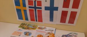 Bild enthält, Plate, Pen, Flag, Person