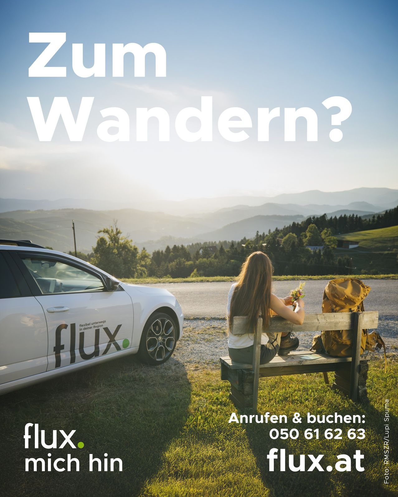 A woman sits on a bench by a white car with the word flux on the side, with a mountainous landscape in the background.