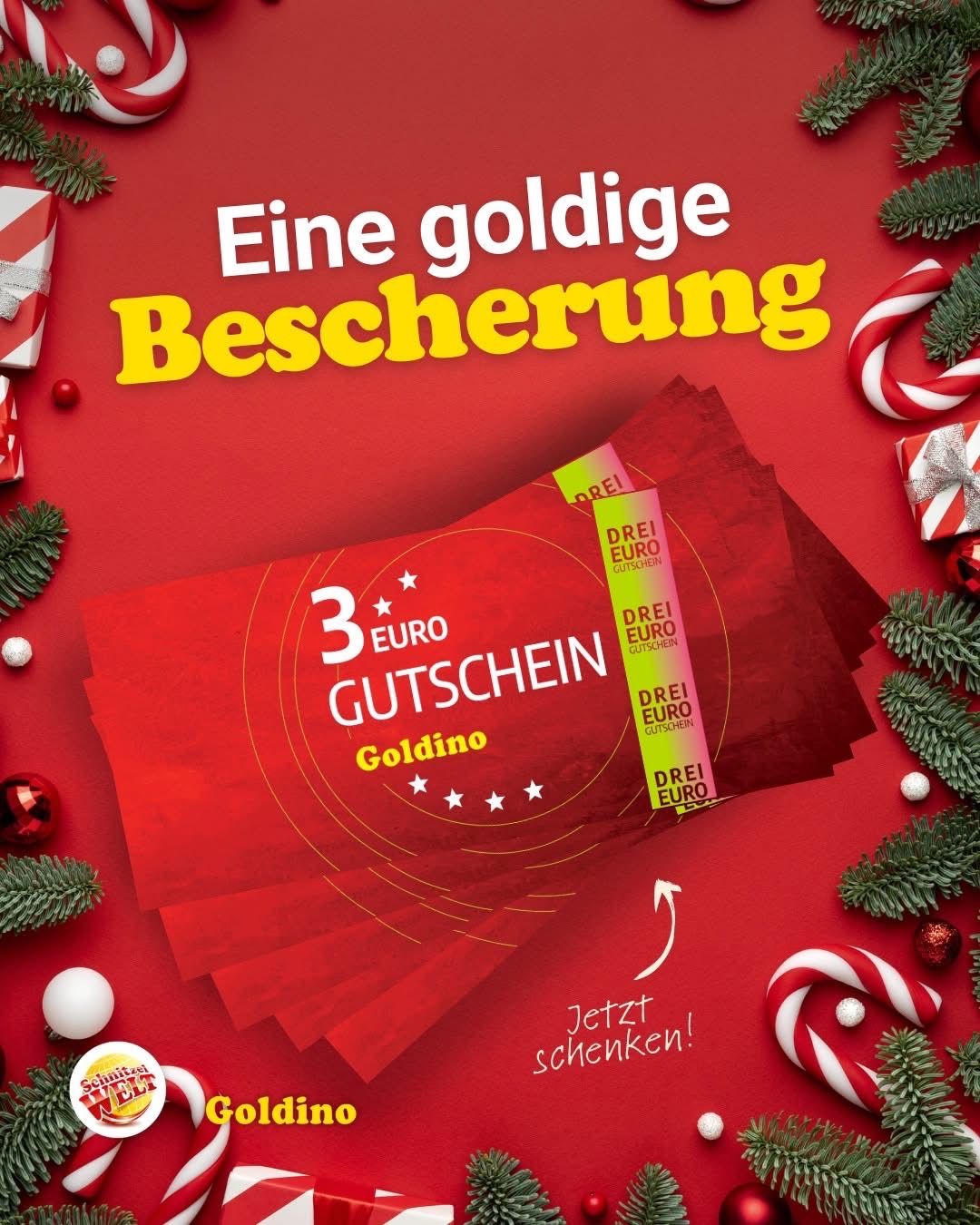 A Christmas gift promotion with a red background, featuring a 3 Euro voucher for Goldino. The voucher is placed on a red surface with a candy cane and Christmas decorations. The text is in German.