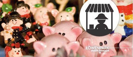 Viele rosafarbene Sparschweine werden in einer verschwommenen Umgebung gezeigt, darunter eine schwarze Silhouette einer Person unter einem Baldachin.