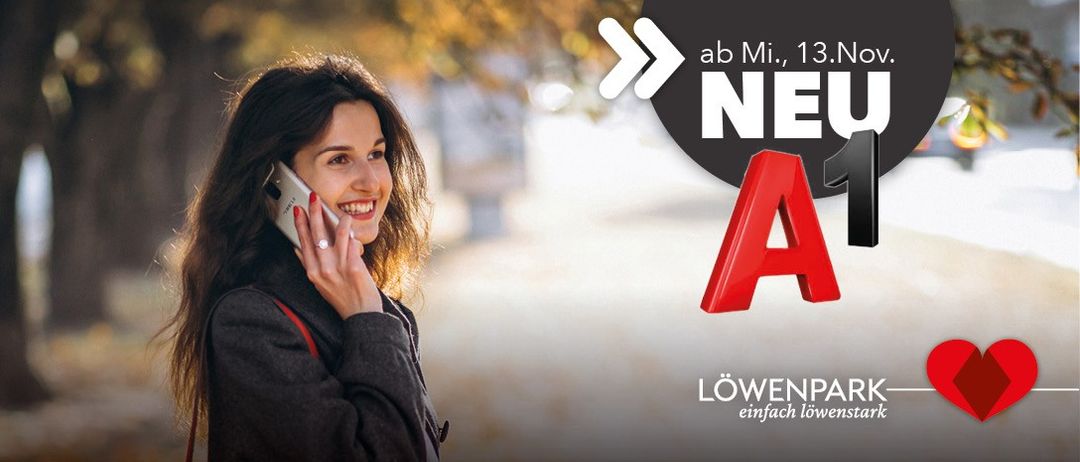 Eine lächelnde Frau telefoniert in einem Park, ein rotes 'A1' Logo und ein 'NEU' Text erscheinen rechts.