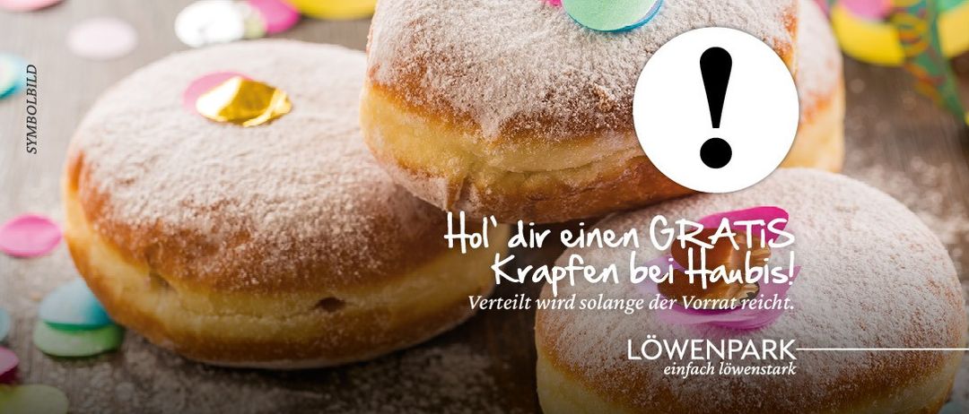 Eine Werbung fur kostenlose Krapfen bei Haubi's. Solange der Vorrat reicht. Der Text ist auf Deutsch.