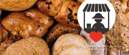 Eine Sammlung von Broten mit einem roten Herzlogo und einer Silhouette einer Person unter einem Vordach.