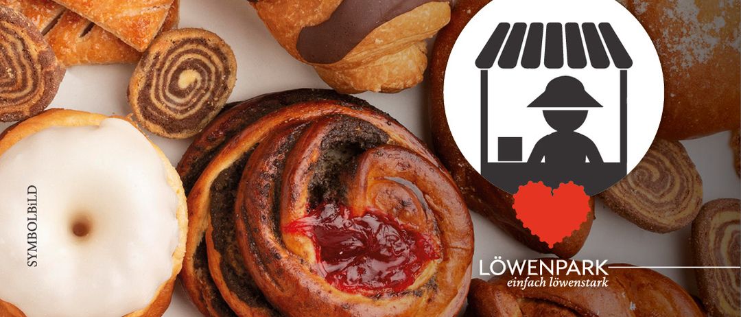Verschiedene Gebäcke, darunter Croissants, dänisches Gebäck und Brötchen, mit einem roten Herz im Logo eines Ladens.