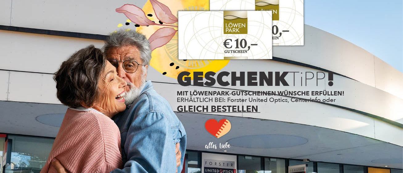 An elderly couple embracing with a 'Geschenktip' sign and a €10 Löwenpark gift card above them. The ad is for Löwenpark vouchers available at Forster United Optics.