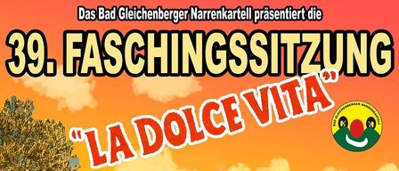 Plakat für die 39. Faschingssitzung mit dem Komikerduo La Dolce Vita. Termine sind Freitag, 13., Samstag, 14. und Sonntag, 15. Februar 2026. Zeiten sind 19:00, 19:00 und 17:00 Uhr. Veranstaltungsort ist Gleichenberg-Halle. Zwei Männer in einem Auto mit einem rosa Schwimmring obenauf.
