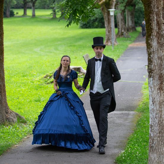 Formal Wear, Dress, Suit, Fashion, Gown, Evening Dress, Person, Coat, Adult, Man