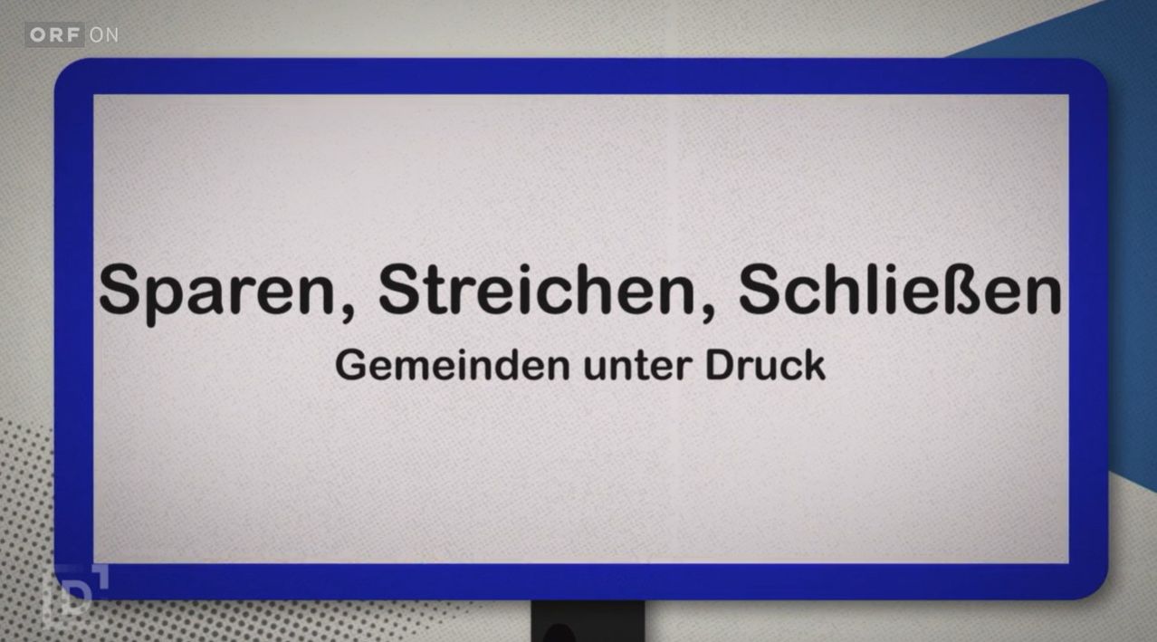 Ein weißes Schild mit blauen Rändern zeigt fetten schwarzen Text, der 'Tränen, Streiks, Schließungen, Gemeinden unter Druck' lautet.