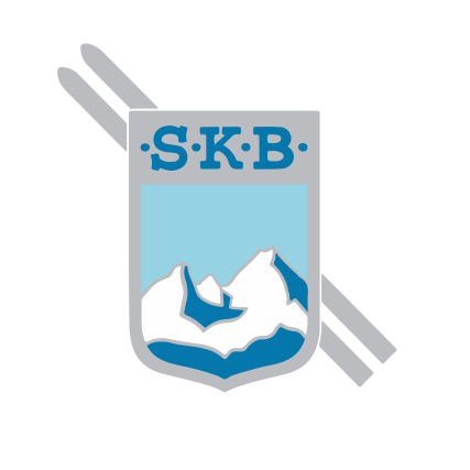 A logo with a shield shape, featuring the letters SKB in blue above a snowy mountain peak. Two skis flank the shield on either side.