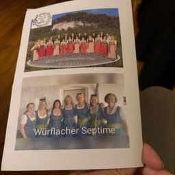Ein Flugblatt zeigt zwei Fotos von Chören. Das obere Foto zeigt einen gemischten Chor mit einer malerischen Kulisse. Das untere Foto zeigt einen Frauenchor mit dem Titel 'Wurflacher Septime.'