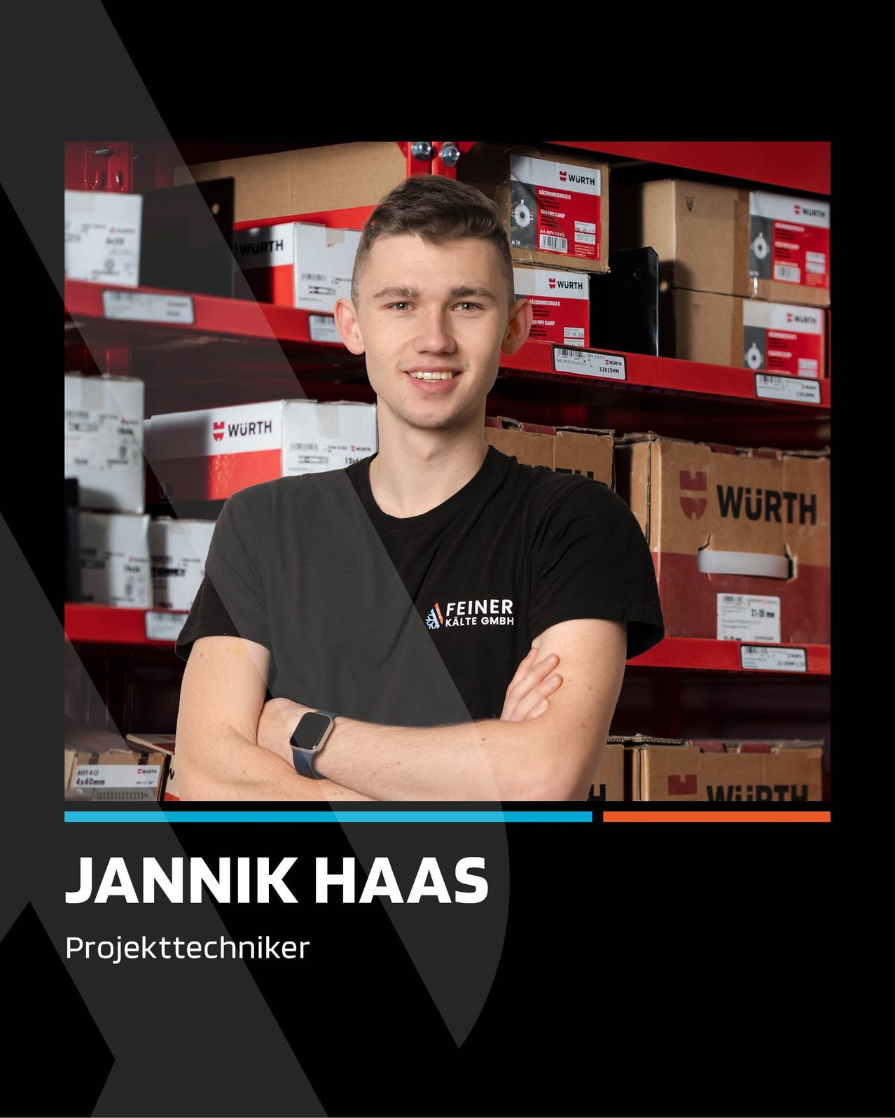 Jannik Haas, a project technician, stands smiling in a warehouse with arms crossed, wearing a black shirt with a logo. Behind him, shelves hold numerous red and white boxes.