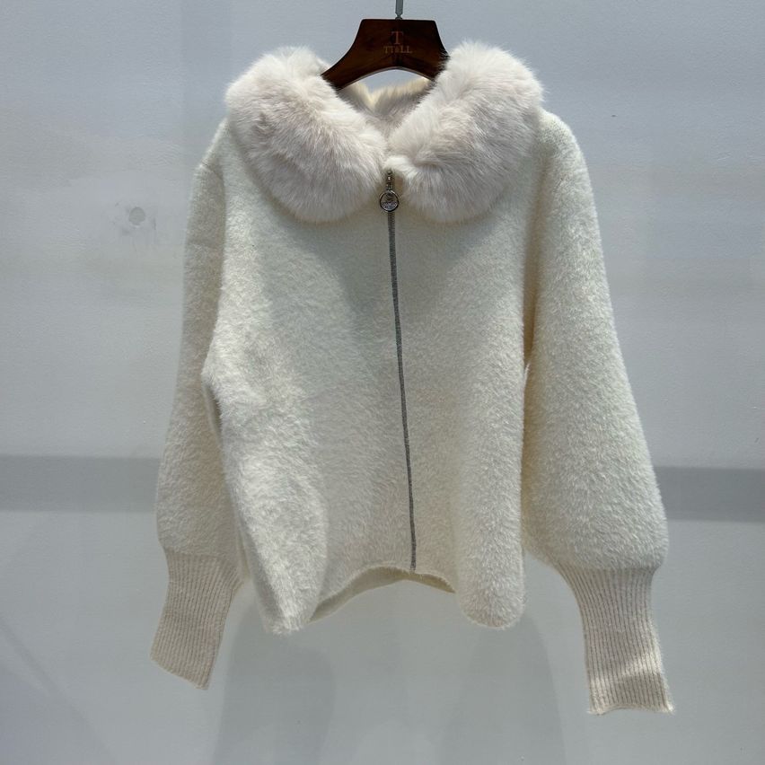 A white fur-trimmed jacket with a zipper is hanging on a hanger against a white background.