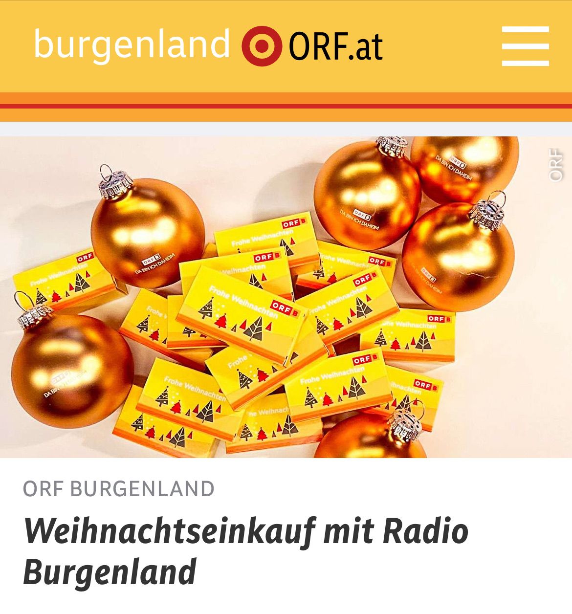 Goldene Weihnachtskugeln und gelbe Karten mit Weihnachtsbaum-Design sind auf einer weißen Oberfläche angeordnet. Der Markenname ORF BURGENLAND ist oben angezeigt.