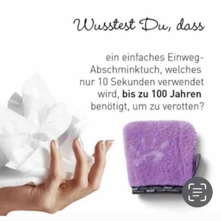 A hand holds a white cloth and a purple sponge beside it. Text reads, 'Did you know that a simple washable cloth takes up to 100 years to decompose?'. The sponge reads, 'Clean the world'.