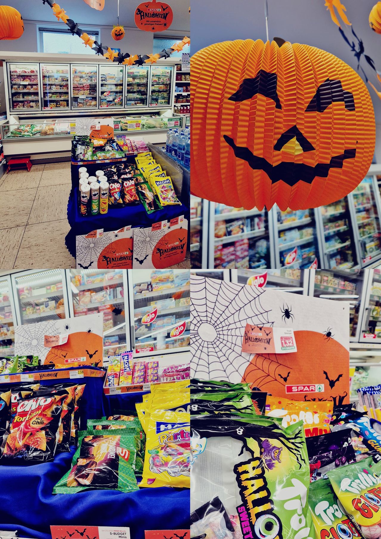 Ein Supermarkt mit Halloween-Dekorationen, einschließlich einer Kürbislaterne, Spinnennetzen und thematischen Süßigkeiten im Schaufenster.