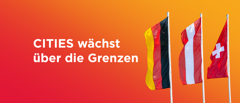 Bild zeigt die Worte 'CITIES wächst über die Grenzen' auf rotem Hintergrund mit drei Fahnen. Die Fahnen sind die Deutschlands, der Niederlande und möglicherweise einer anderen europäischen Nation.