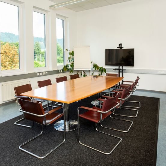 Indoors, Interior Design, Chair, Meeting Room, Office, Screen, Computer Hardware, Monitor, Table, Tabletop