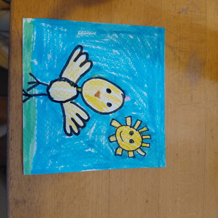 A child's drawing of a bird flying over a smiling sun on a blue background.