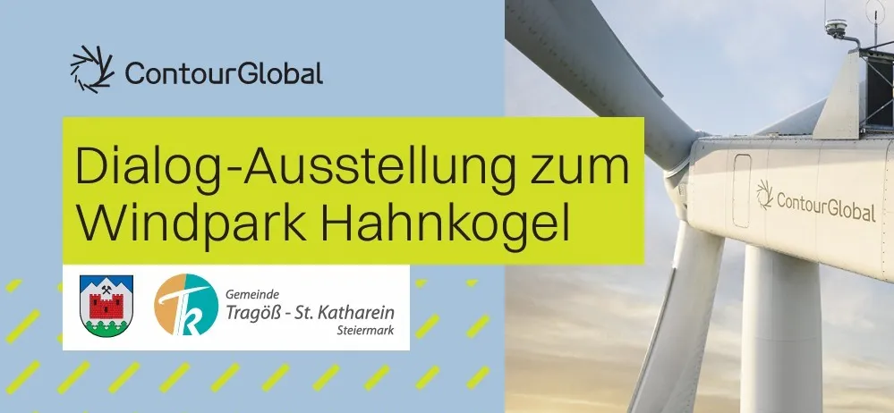 Eine Anzeige für einen Windpark Hahnkogel mit einem Windrad im Hintergrund.
