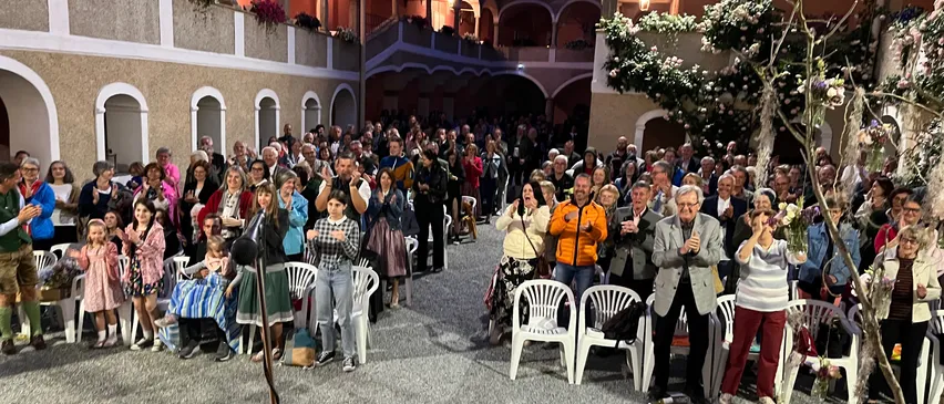 People, Person, Building, Housing, Villa, Crowd, Urban, Indoors, Chair, Audience