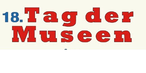 A white banner with red text reading '18. Tag der Museen', which translates to '18th Museum Day' in English.