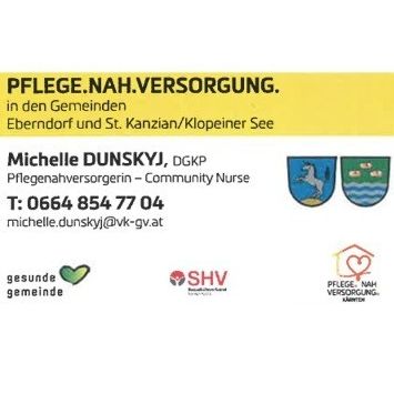 Ein gelbes Schild zeigt den Text 'Pflege.nah.versorgung' in den Gemeinden Ebendorf und St. Kanzian/Klopeiner See. Es zeigt eine Kontaktperson namens Michelle Dunsky, eine Krankenschwester, mit Telefonnummer und E-Mail-Adresse. Logos für Gesundheitsdienstleistungen sind ebenfalls vorhanden.