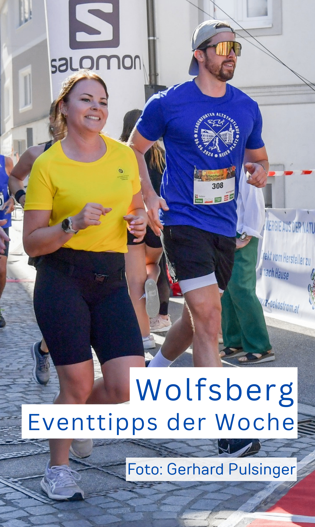 Eine Gruppe von Menschen, die an einem Marathon teilnehmen, darunter eine Frau in Gelb und ein Mann in Blau. Der Mann hat die Nummer 308 auf seinem Shirt.