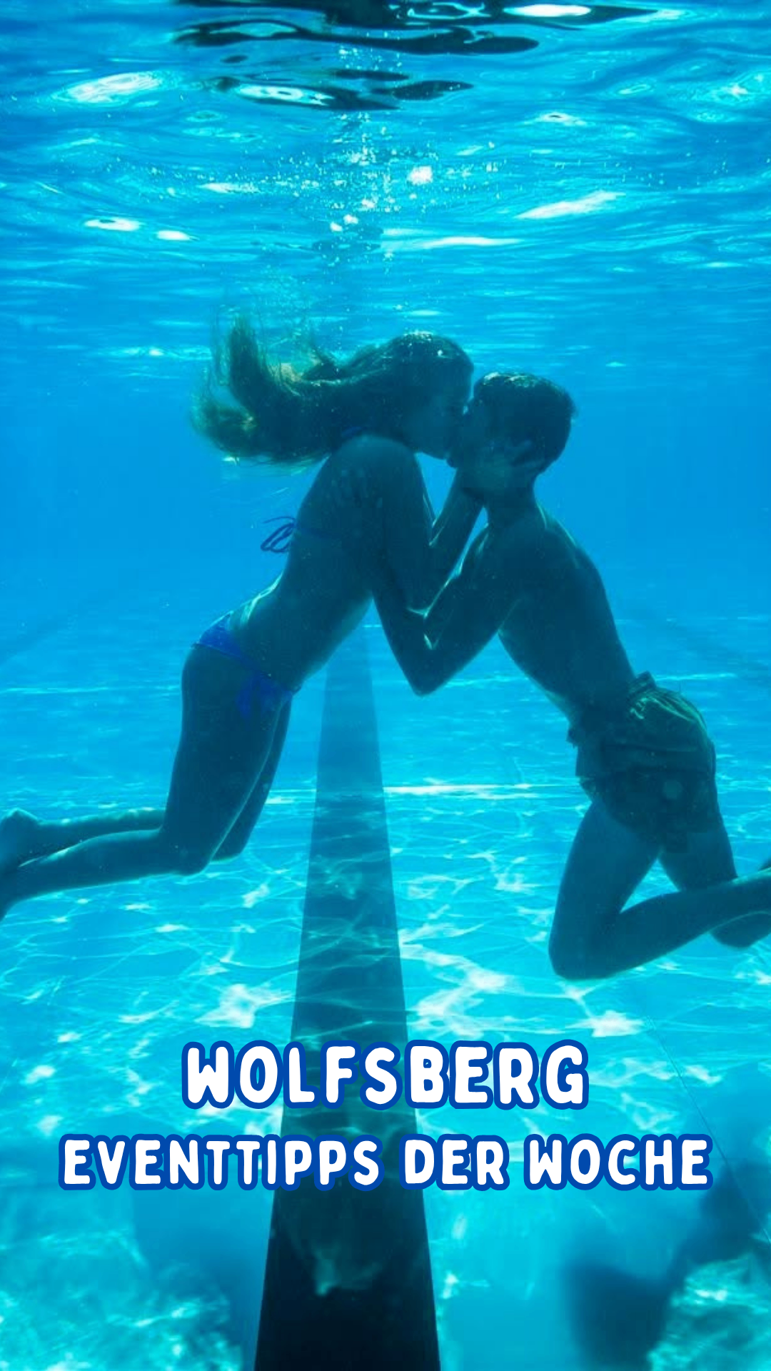 A boy and a girl are kissing underwater in a pool. The girl is wearing a blue bikini, and the boy is shirtless. The water is clear, and there is a lane line in the pool.