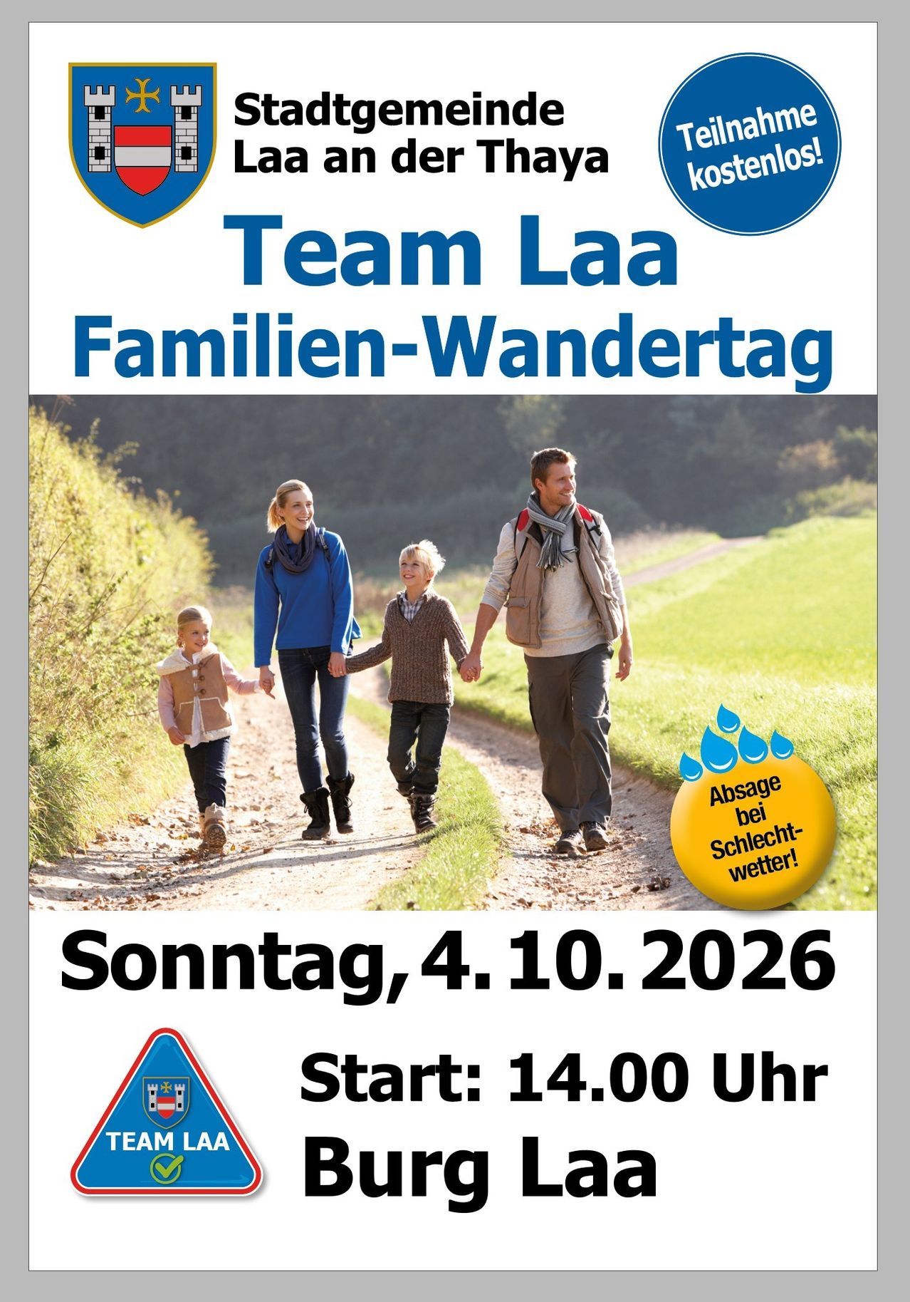 Poster for Team Laa Family Hiking Day on October 4, 2026, featuring a family walking on a dirt path with a scenic background.