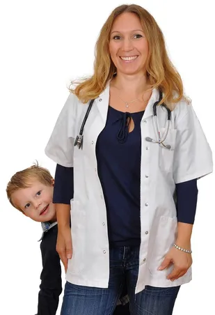 Clothing, Coat, Lab Coat, Adult, Female, Person, Woman, Face, Head, Baby