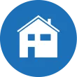 Blauer Kreis-Icon mit einem weißen Haussymbol darin, vermutlich ein Zuhause oder eine Residenz darstellend.