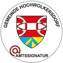 Das Logo für Gemeinde Hochwolkersdorf, mit einem rot-weißen Schild, einem blau-gelben Dreieck in der Mitte und der Aufschrift 'Amtssignatür' darunter.